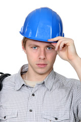 Electrician stood with coil over shoulder