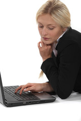 Woman typing on her laptop