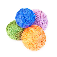 A few balls of wool on a white background