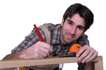 Man measuring furniture