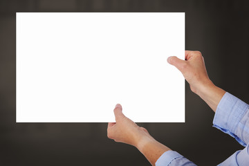 Hands holding up poster
