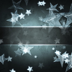 silver stars over dark grey christmas background with text space