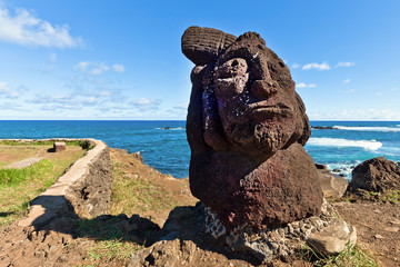 Short standing moai at shore in Easter Island