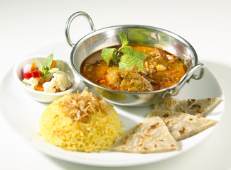 Indian curry served with rice and naan