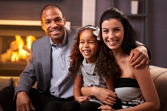 Portrait of happy diverse family at home