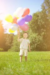 Сhild with a bunch of balloons in their hands