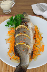 Baked trout on onion-carrot cushion