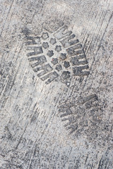 Grunge textured concrete sidewalk shoe foot print
