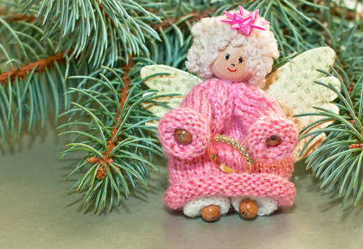 Agel with wedding ring.