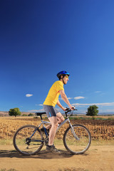 Obraz premium Biker in yellow shirt riding a bike, Macedonia