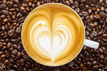 Latte art, coffee in coffee beans background