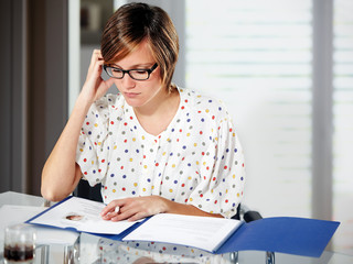 young lady preparing documents for application