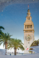 Reflection of the Ferry Building on the puddle, San Francisco