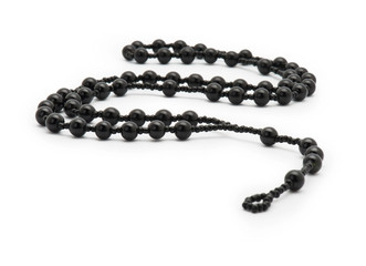 Black rosary isolated on white