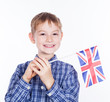 A little boy with english flag on the white background