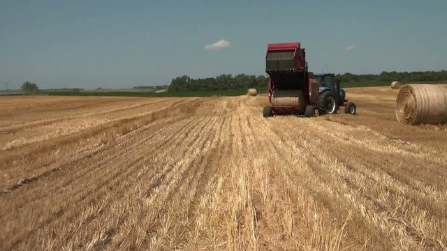 Hay Bail Unloaded in Farm Field
