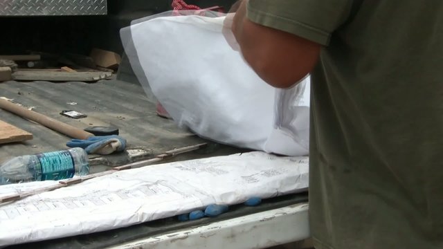 Folding Construction Plans in Sun