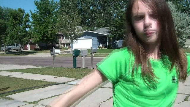 Girl Simulating Mixed Martial Arts at Camera