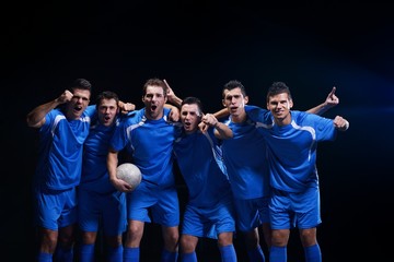 soccer players celebrating victory