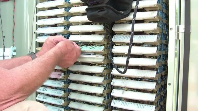 Telephone Worker Touching Wires