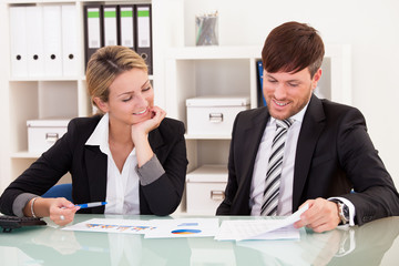 Business partners discuss sales