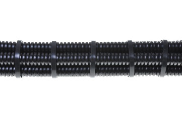 Black plastic corrugated pipe with cable ties