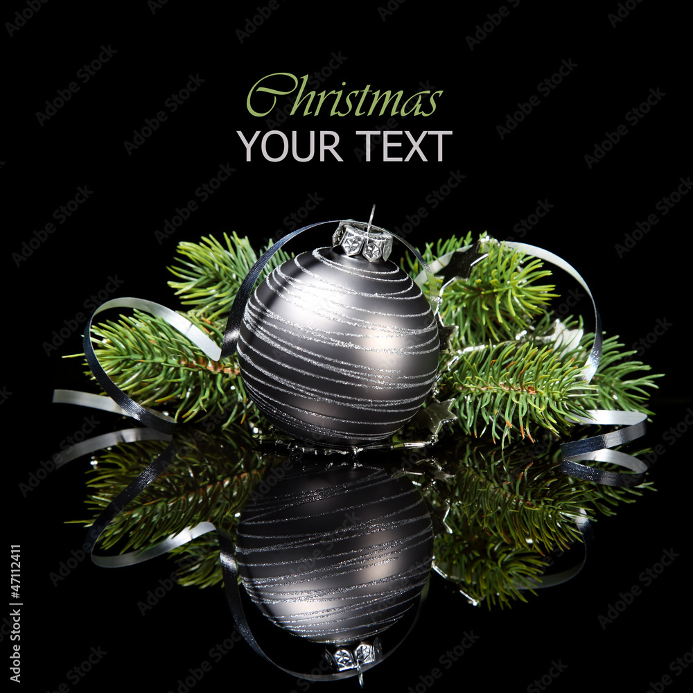 Wall mural christmas ornament with pine tree branches on a black background