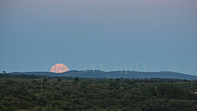 Full moon over windmills