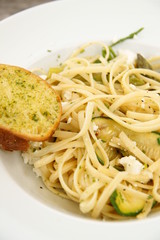 Linguini Pasta with garlic bread, Feta, Cheese and vegetables