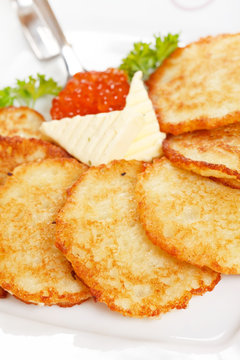 fried potatoes pancakes with caviar