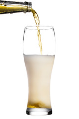 Beer is pouring into glass on white background