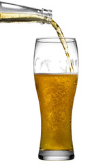 Beer is pouring into glass on white background