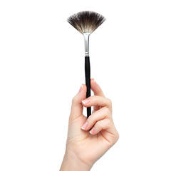 isolated female hand with brush for makeup