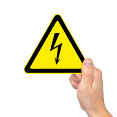 isolated male hand holding sign of danger high voltage symbol