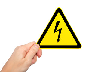 isolated male hand holding sign of danger high voltage symbol