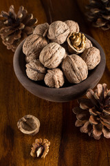 Autumn still life with walnuts on wooden table