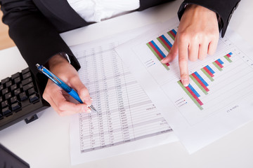 Woman working with bar graphs