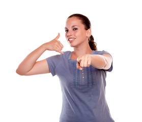 Young woman pointing looking at you saying call me