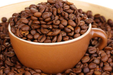 Coffee beans and cup close-up