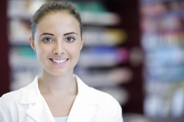 Naklejka premium Portrait of Smiling Woman Pharmacist in Pharmacy