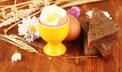Boiled eggs on wooden background