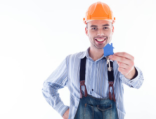 A builder man holding a key and a paper house.