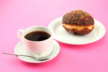 Tasty donuts on color plate on color background