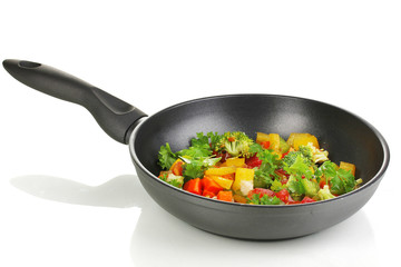 Sliced fresh vegetables in pan isolated on white