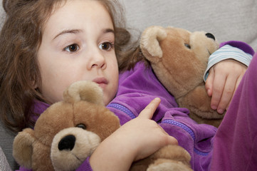 little girl with teddy bears