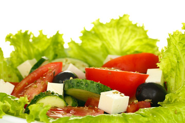 tasty greek salad on white background close-up