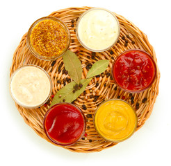 various sauces on wicker mat