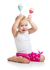 funny baby girl playing with musical toy