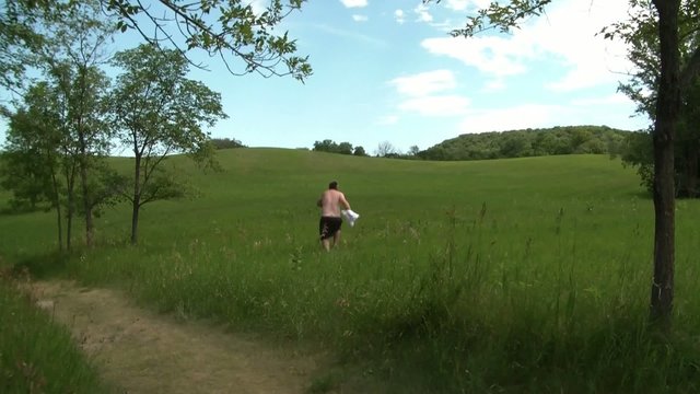 Crazy Man Takes Off Shirt, Runs Into Meadow
