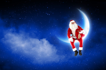 Fototapeta na wymiar Zdjęcie Santa Claus siedzi na księżycu